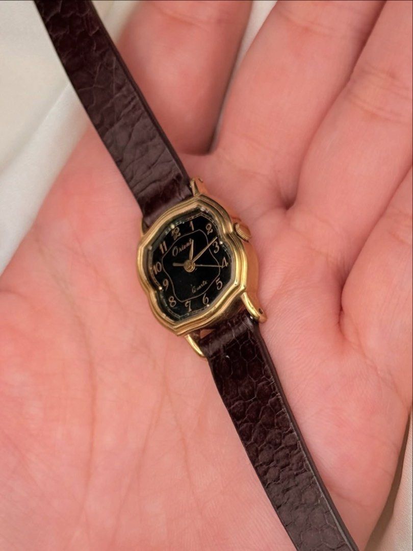 Vintage Orient Dainty Watch (Category: Women's Watches) located in Lipa City. Submitted by watchoutph (Listing ID 1467549290, Image 3). Description: Vintage Orient Small-Faced Watch (Rare) Black Dial octagonal cushion-shaped case with stepped bezel Quartz Arabic indices Gold case 19x20mm case Multiple scratches on glass For collectors ₱4,500.