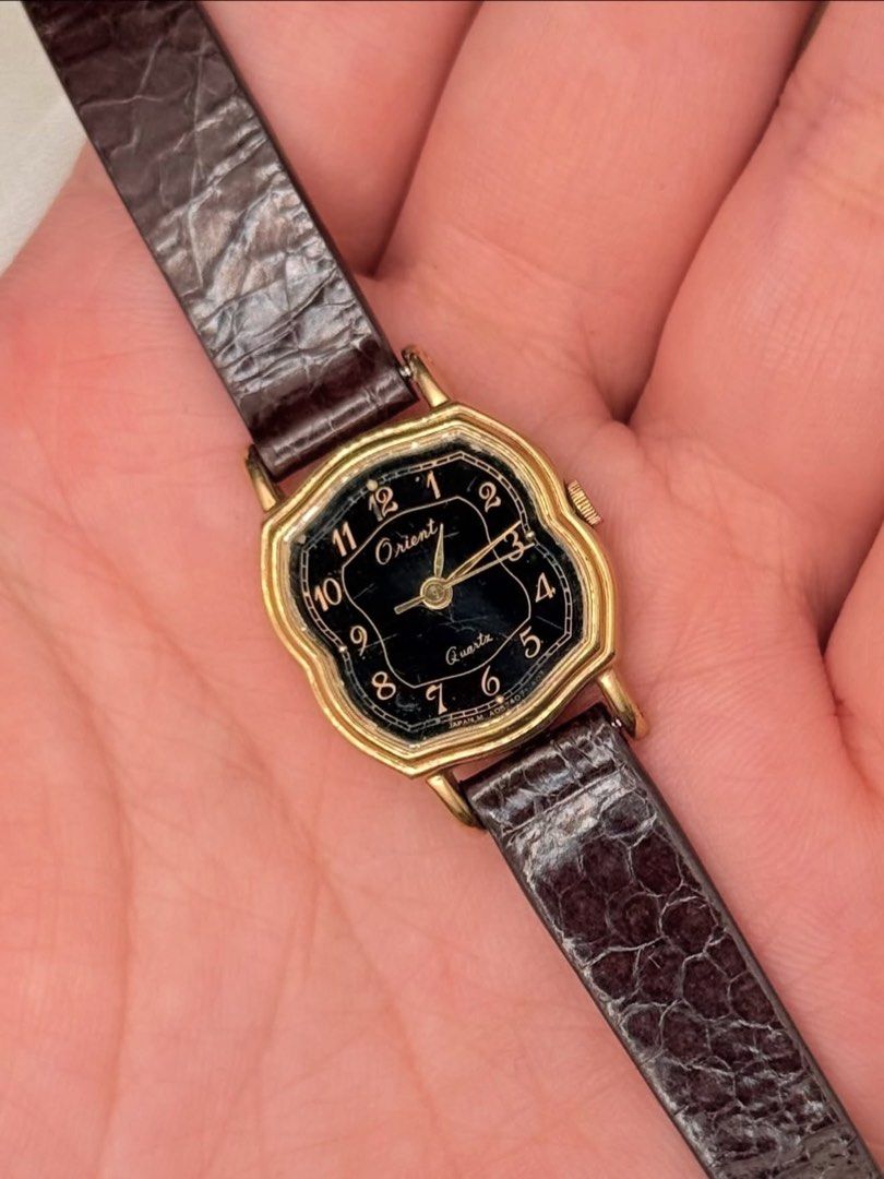 Vintage Orient Dainty Watch (Category: Women's Watches) located in Lipa City. Submitted by watchoutph (Listing ID 1467549290, Image 1). Description: Vintage Orient Small-Faced Watch (Rare) Black Dial octagonal cushion-shaped case with stepped bezel Quartz Arabic indices Gold case 19x20mm case Multiple scratches on glass For collectors ₱4,500.