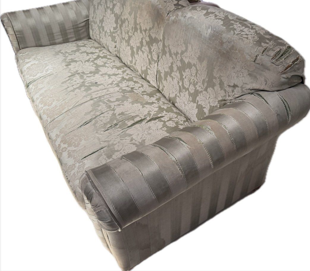 Vintage patterned 3-seater sofa with striped armrests (Category: Sofas) located in Taguig. Submitted by kgonda (Listing ID 1467430942, Image 2). Description: - Type: Vintage 3-seater sofa - Design: Scalloped back with floral backrest/seat cushions and striped rolled armrests and base skirt - Frame: Sturdy solid wood underneath - Condition: Noticeable wear, fabric fraying, and tear lines on the seat cushions; stuffing has lost some firmness - Idea