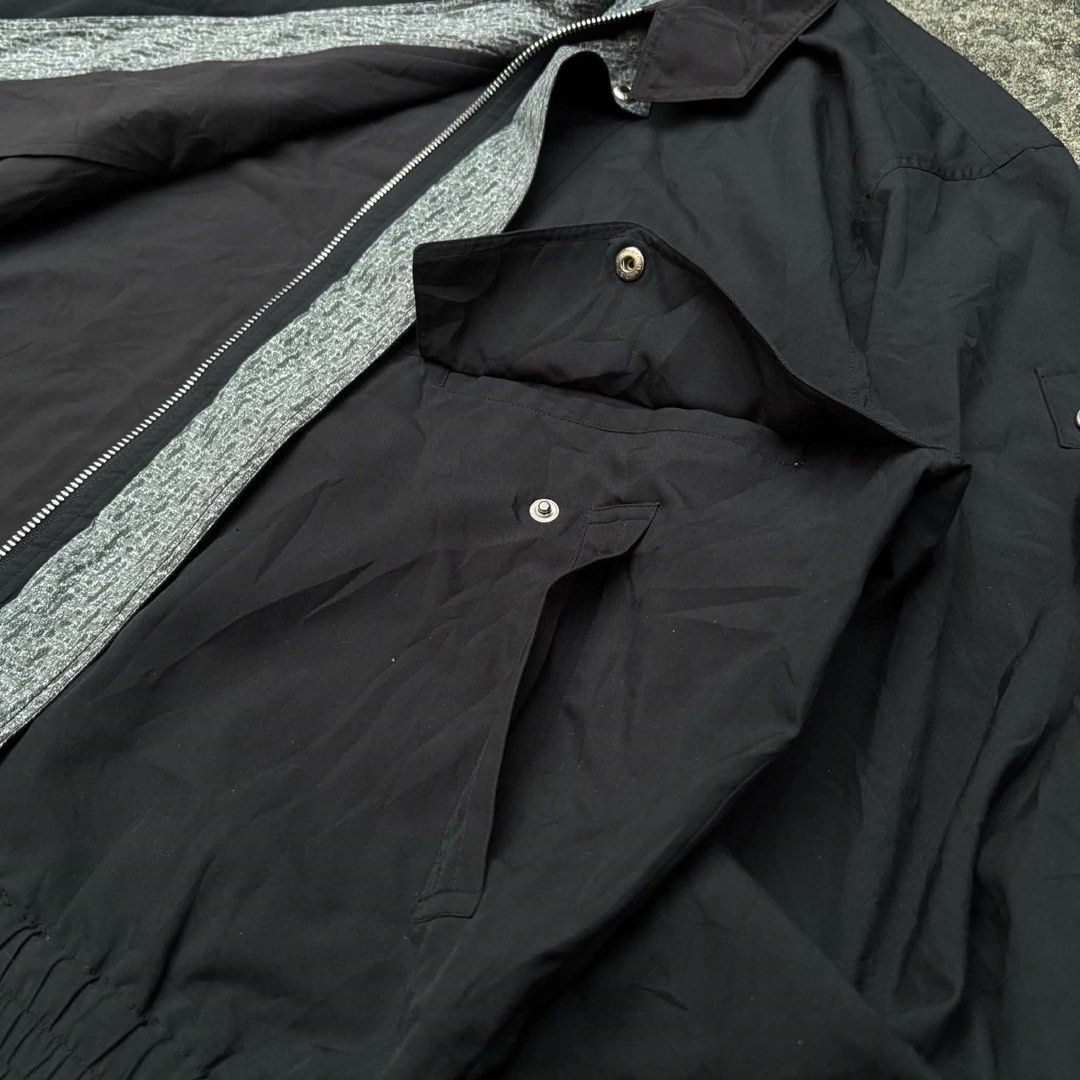 Vintage Paul Dundy Pilot Bomber Jacket (Category: Coats, Jackets and Outerwear) located in Manila. Submitted by vvyein_ (Listing ID 1467547309, Image 2). Description: - Brand: Paul Dundy (Japanese brand) - Color: Classic Black - Design: Embroidered kangaroo logo on the chest with stylish contrasting grey patterned inner collar and zipper trim - Pockets: Functional snap-button chest pockets - Fit: Classic bomber style with a ribbed hem and button 