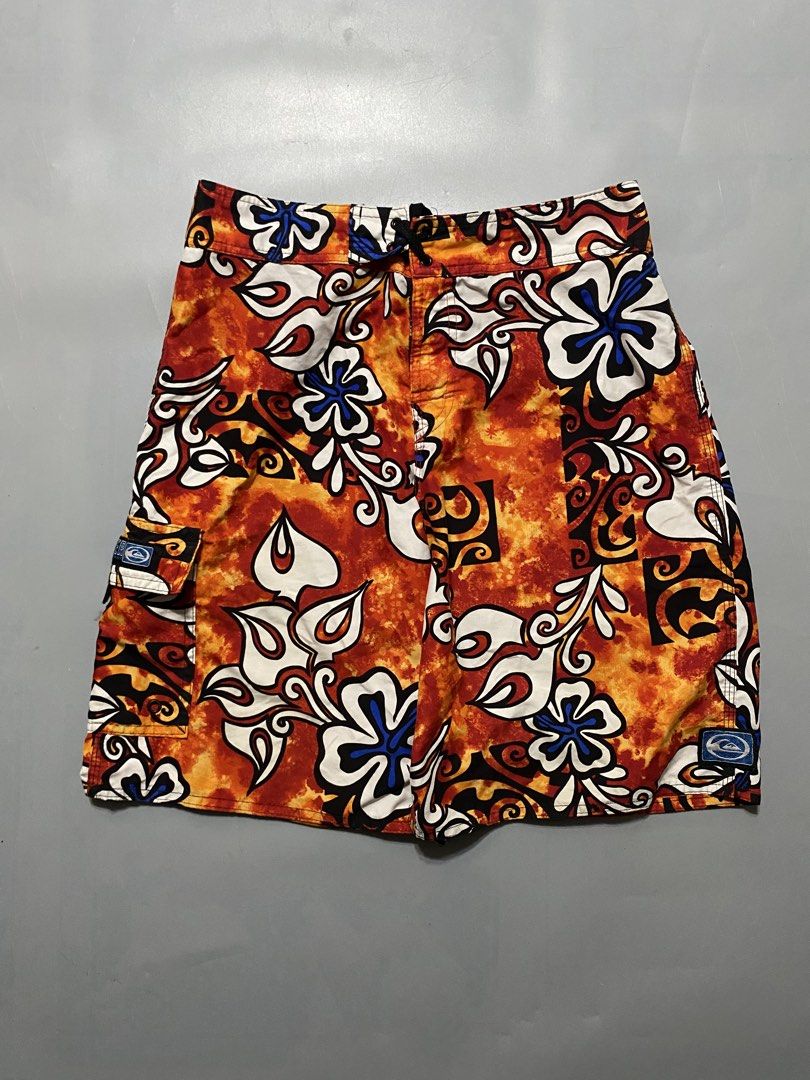 Vintage Quiksilver Board Shorts (Category: Swim Trunks & Board Shorts) located in Manila. Submitted by delunakenn94368 (Listing ID 1467509391, Image 1). Description: - Brand: Quiksilver - Size: 32 - Color/Design: Orange, black, and white floral print - Features: Side cargo pocket with branded patch, secure drawstring waist - Style: Classic surf style, vibrant and eye-catching.