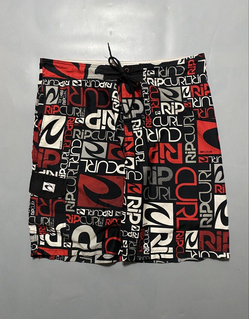 Vintage Rip Curl Board Shorts (Category: Swim Trunks & Board Shorts) located in Manila. Submitted by delunakenn94368 (Listing ID 1467509323, Image 1). Description: - Authentic Rip Curl board shorts - Striking all-over logo print in black, red, and white - Secure drawstring waistband with lace-up closure - Convenient side cargo pocket with button flap - Lightweight, quick-dry fabric ideal for surfing, swimming, and beach days - Refer to tag for ex