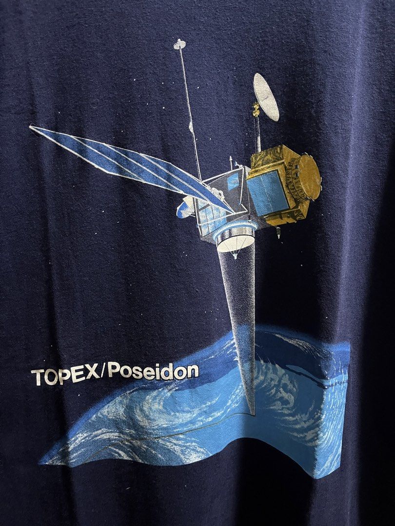 Vintage space satellite graphic shirt (Category: Tshirts & Polo Shirts ) located in San Simon. Submitted by t3_thrifts (Listing ID 1467570526, Image 2). Description: The shirt image shows a vintage 1990s TOPEX/Poseidon graphic (printed on a Fruit of the Loom blank) depicting the joint NASA/CNES oceanography satellite. Dimensions: 22W x 30L Issue/s: Minimal hairline Minimal lints Price: 900 php Courier: J&T, Lalamove, LBC Seller Location: Apalit P