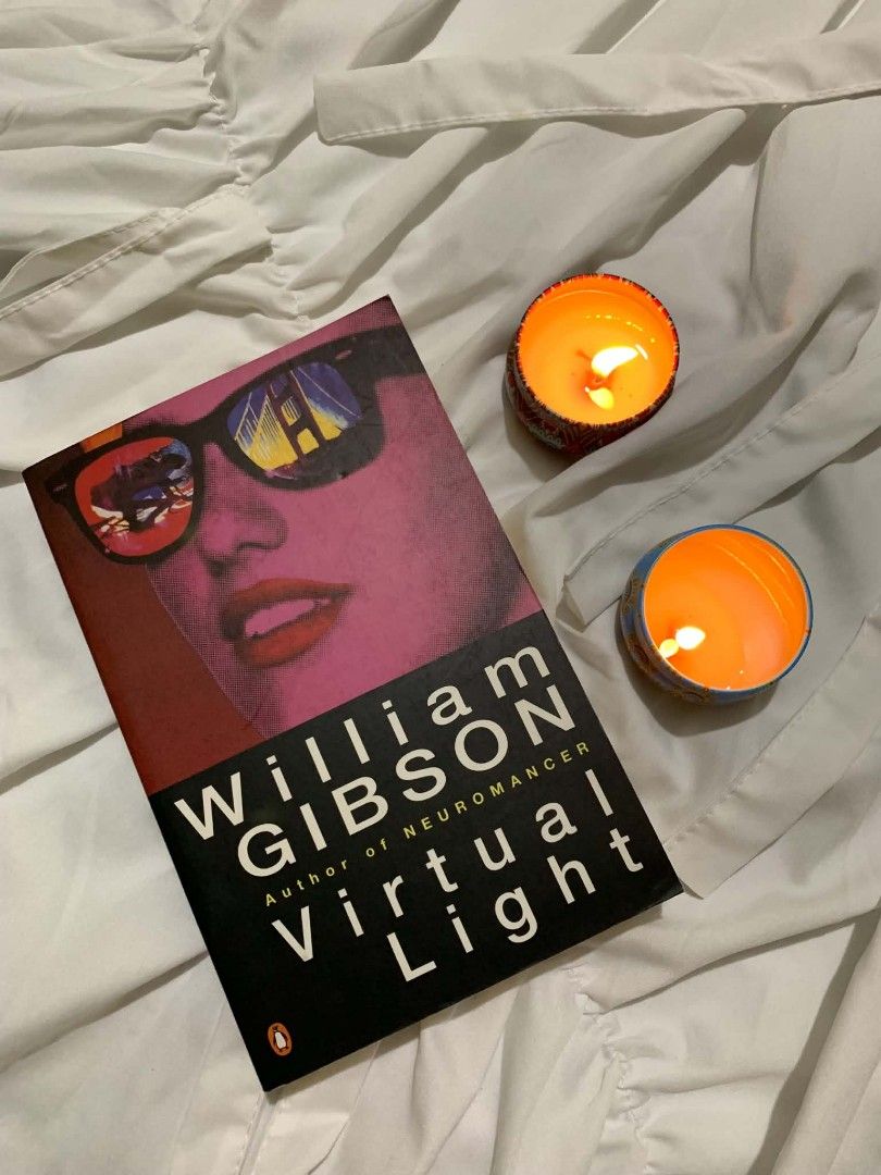 Virtual Light by William Gibson Paperback Novel (Category: Storybooks) located in General Trias. Submitted by bookshineph (Listing ID 1467554943, Image 1). Description: - Title: Virtual Light by William Gibson (Author of Neuromancer) - Edition: Penguin edition featuring the iconic pink sunglasses cover art with Golden Gate Bridge reflection - Genre: Classic cyberpunk and speculative fiction - Condition: Crisp spine and clean pages, well-maintaine