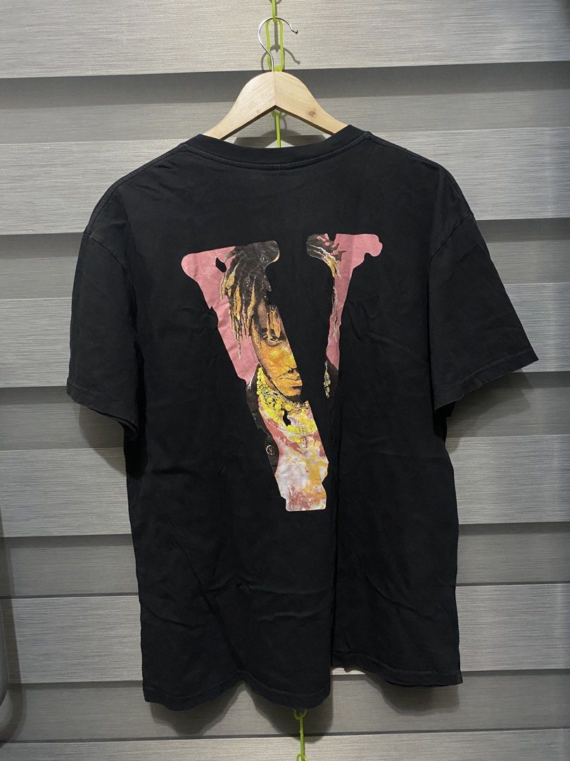 Vlone x Juice WRLD Legends Never Die Tee (Category: Tshirts & Polo Shirts ) located in Butuan. Submitted by nielben13 (Listing ID 1467505967, Image 2). Description: - Vlone x Juice WRLD collaboration t-shirt in classic black - Premium cotton fabric for everyday streetwear comfort - Front features 'Legends Never Die' and 'Juice WRLD' text in white - Back showcases the large signature Vlone 'V' logo with a Juice WRLD graphic inside - Crew neck and 