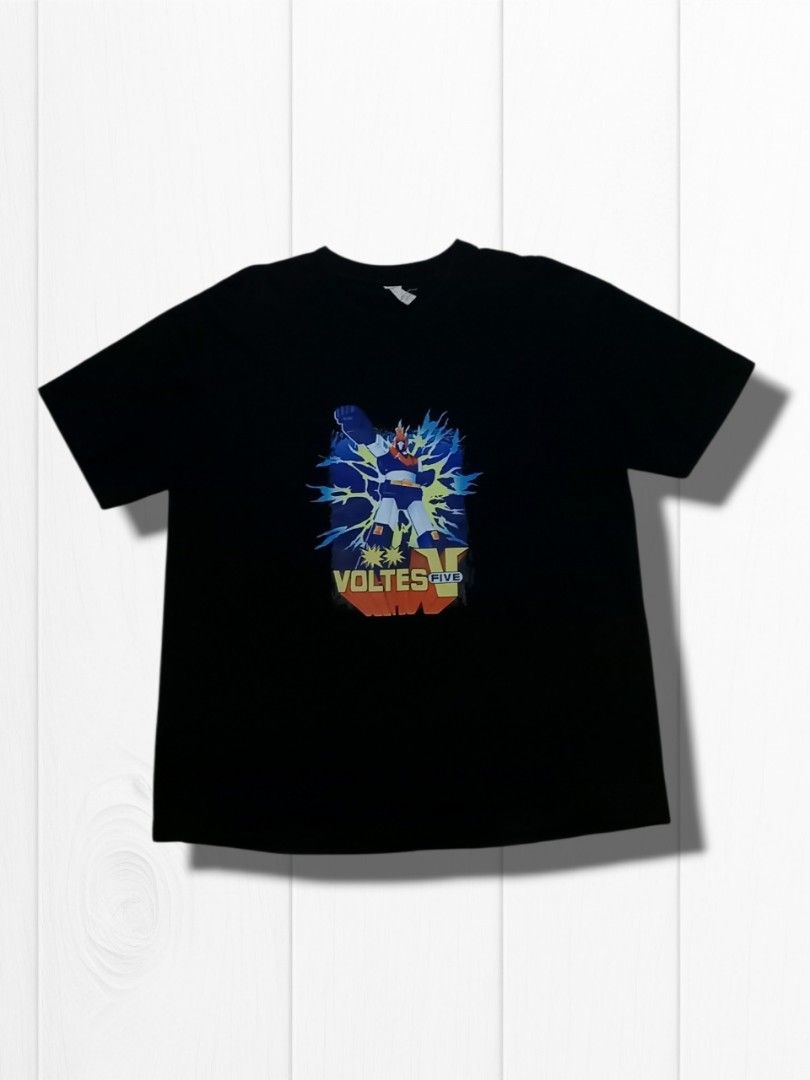 Voltes V Graphic Tee Black Short Sleeve Tshirt (Category: Tshirts & Polo Shirts ) located in Aguinaldo. Submitted by ukayandthrift (Listing ID 1467384340, Image 1). Description: - Color: Black - Design: Voltes V graphic print with lightning effects - Fit: Standard fit - Neckline: Classic crew neck - Style: Casual everyday tee, perfect for anime fans - Condition: Excellent.
