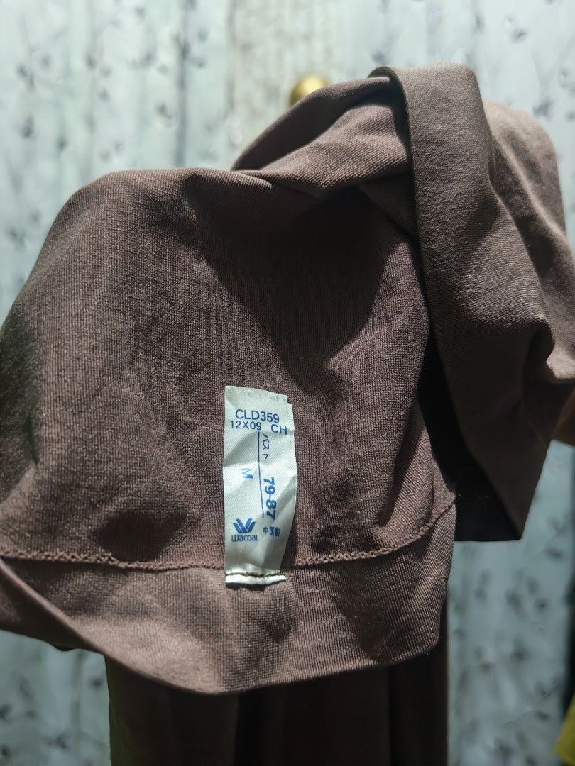 Wacoal Brown Long Sleeve Top Size M (Category: Longsleeves) located in Caloocan City. Submitted by _misskaye (Listing ID 1467474060, Image 2). Description: - Brand: Wacoal - Color: Brown - Size: M (Chest: 79-87 cm) -Like a bodysuit without snap closure - Material: Comfortable ribbed cotton texture - Style: V-neckline with 3/4 sleeves (Model: CLD359) - Origin: Made in China - Condition: Great everyday basic piece.