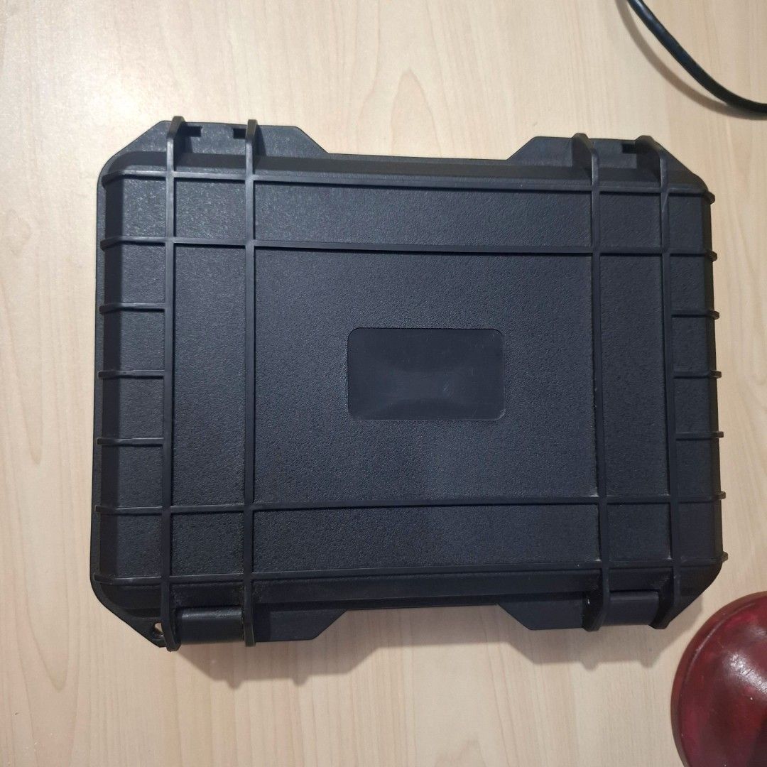 Waterproof Hard Shell Storage Case Protective Box 24x20x7cm (Category: Storage Boxes & Baskets) located in Quezon City. Submitted by an.marie (Listing ID 1467527657, Image 1). Description: - Heavy-duty black hard case with a thick molded plastic shell for ultimate protection - Watertight design keeps your gear safe from moisture - Equipped with a side pressure release valve - Durable latches ensure contents stay secure - Built-in handle for conve