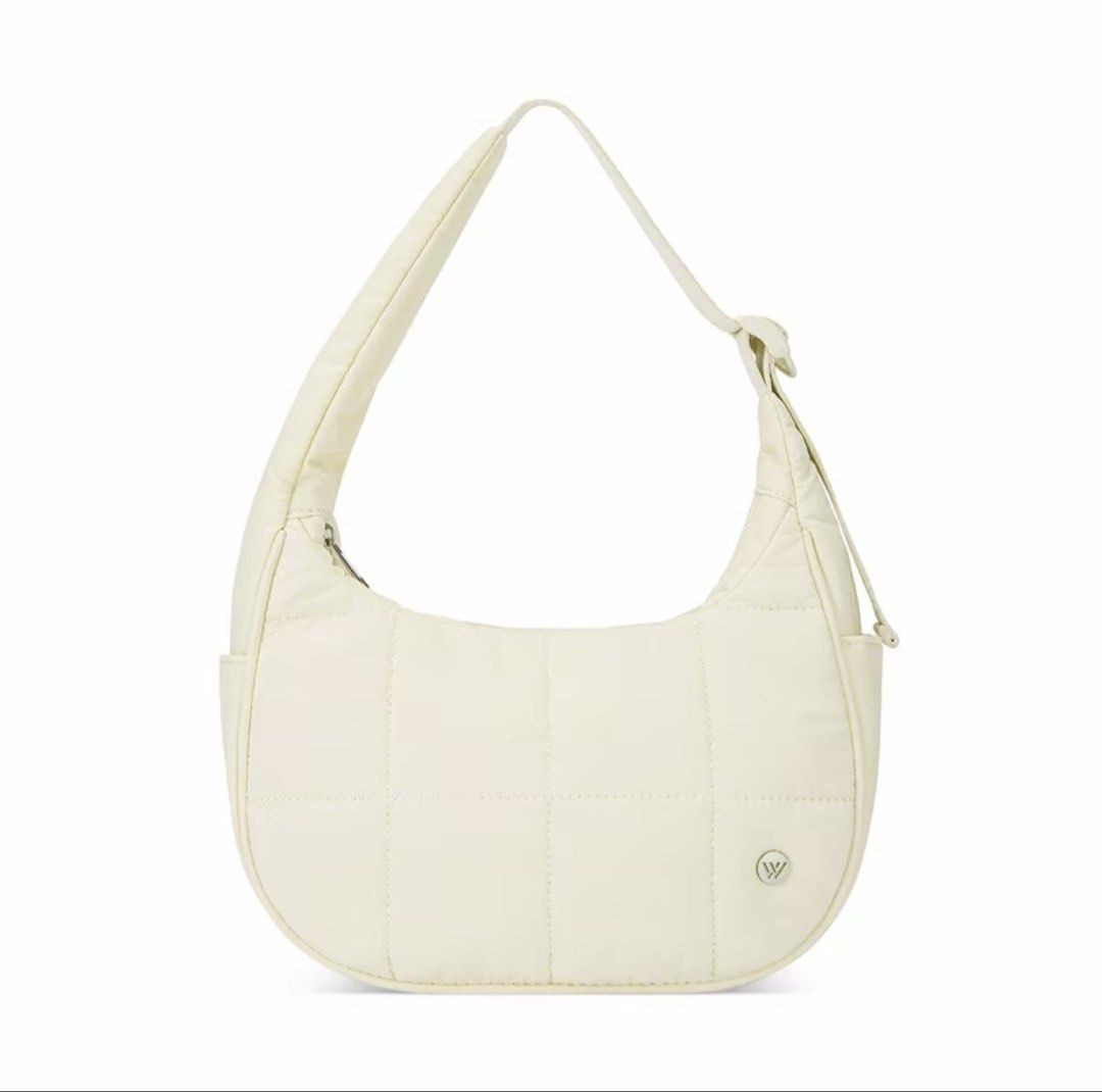 Westbronco Quilted Puffer Shoulder Bag Cream (Category: Shoulder Bags) located in Cebu City. Submitted by meowmeowmeowrie (Listing ID 1467492563, Image 1). Description: - Brand: Westbronco - Color: Creamy off-white - Material: Soft, lightweight quilted nylon - Dimensions: Approx. 10.3" L x 6.4" H x 4.1" D - Strap: Adjustable drop from 8" to 13" - Closure: Secure zip top - Storage: Multiple interior compartments and exterior pockets - Capacity: Ea