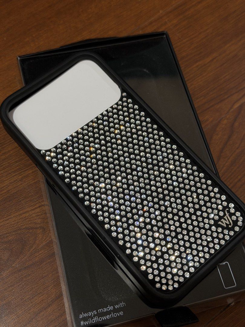 WF Iphone 17 Pro Max Case (Category: Cases & Sleeves) located in Binan City. Submitted by clgruiz (Listing ID 1467456298, Image 2). Description: Wildflower-inspired design, similar to the original 💎 Bedazzled details for a cute, sparkly look 📱 Compatible with iPhone 17 Pro Max 🎀 Perfect for a girly, coquette, and aesthetic vibe ✨ A pretty alternative to the original Wildflower case 🛍️ Great for everyday use! Payment through Gcash only!.