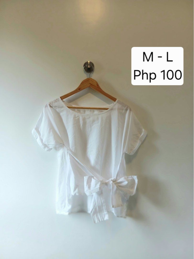 White Blouse with Side Bow Detail Size M-L (Category: Blouses) located in Antipolo. Submitted by wisecat.4a7eea (Listing ID 1467401374, Image 1). Description: - Color: White - Style: Short-sleeve top with side wrap bow detail - Fit: Relaxed fit, round neckline - Size: M-L - Condition: Clean, ready to wear - Perfect for: Casual days, pairs great with jeans or skirts.