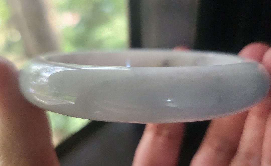 White Burmese Jadeite Bangle 60.4mm (Category: Bracelets) located in Baguio. Submitted by lausgem2026 (Listing ID 1467427414, Image 2). Description: -A white Burmese Jadeite Bangle with some sajin (sprinkled gold/yellow) and wuji (gray) colors. -Grade A (natural and untreated). -60.4mm diameter size. 12.4mm thickness. -Comes with a free box and free certificate. -Note: expect stonelines for its price range. -Location: Baguio City.