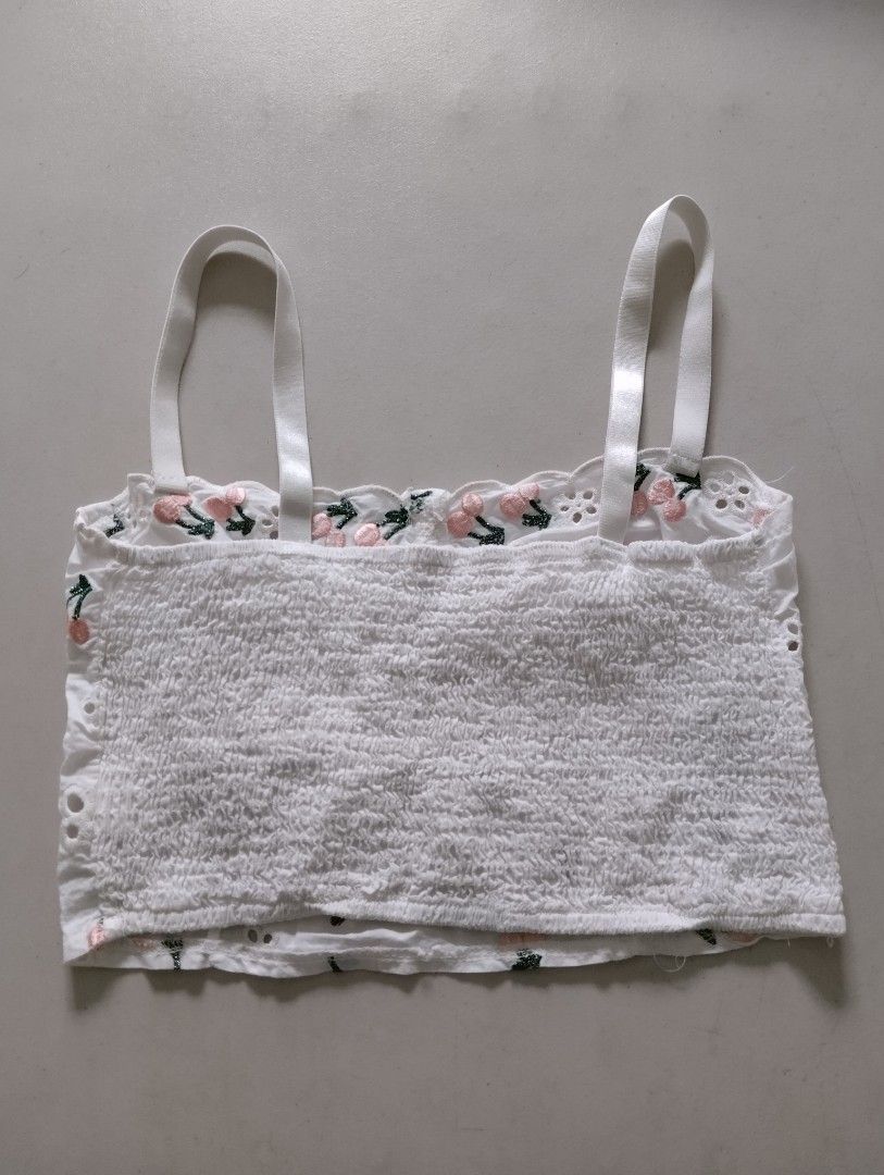Pre-loved WHITE EYELET CHERRY EMBROIDERED CROP TOP BRALETTE - Size Medium Small (Category: Sleeveless) located in Paranaque City. Submitted by SpencersMommy (Listing ID 1467436080, Image 2). Description: EYELET BRALETTE / CROP TOP *pre-loved, 8/10 condition Color: White with Pink Cherry Embroidery Size on tag: M (will fit Small-Medium) Measurements when laid flat: Armpit to armpit 13.5 inches, stretchable to 15.5 inches Length 14 inches > stretch