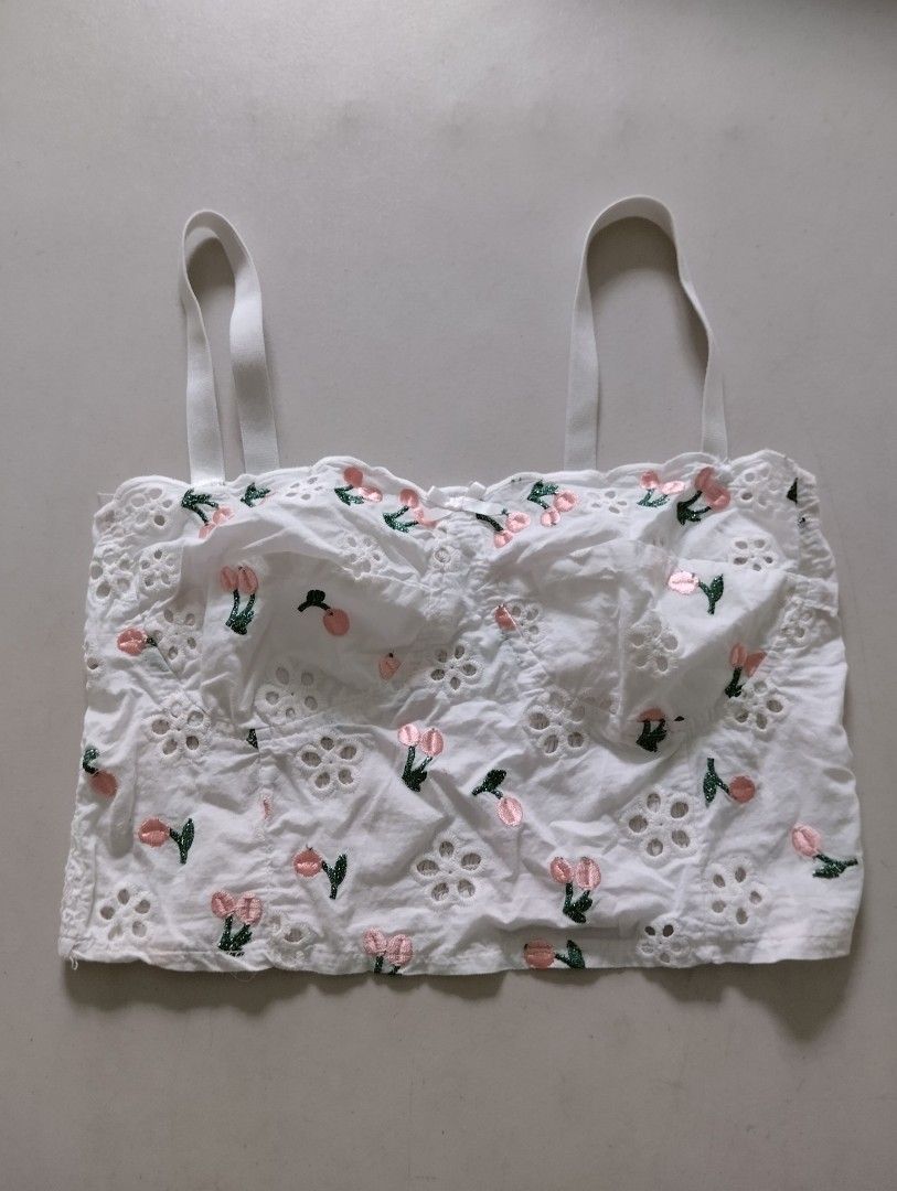 Pre-loved WHITE EYELET CHERRY EMBROIDERED CROP TOP BRALETTE - Size Medium Small (Category: Sleeveless) located in Paranaque City. Submitted by SpencersMommy (Listing ID 1467436080, Image 1). Description: EYELET BRALETTE / CROP TOP *pre-loved, 8/10 condition Color: White with Pink Cherry Embroidery Size on tag: M (will fit Small-Medium) Measurements when laid flat: Armpit to armpit 13.5 inches, stretchable to 15.5 inches Length 14 inches > stretch
