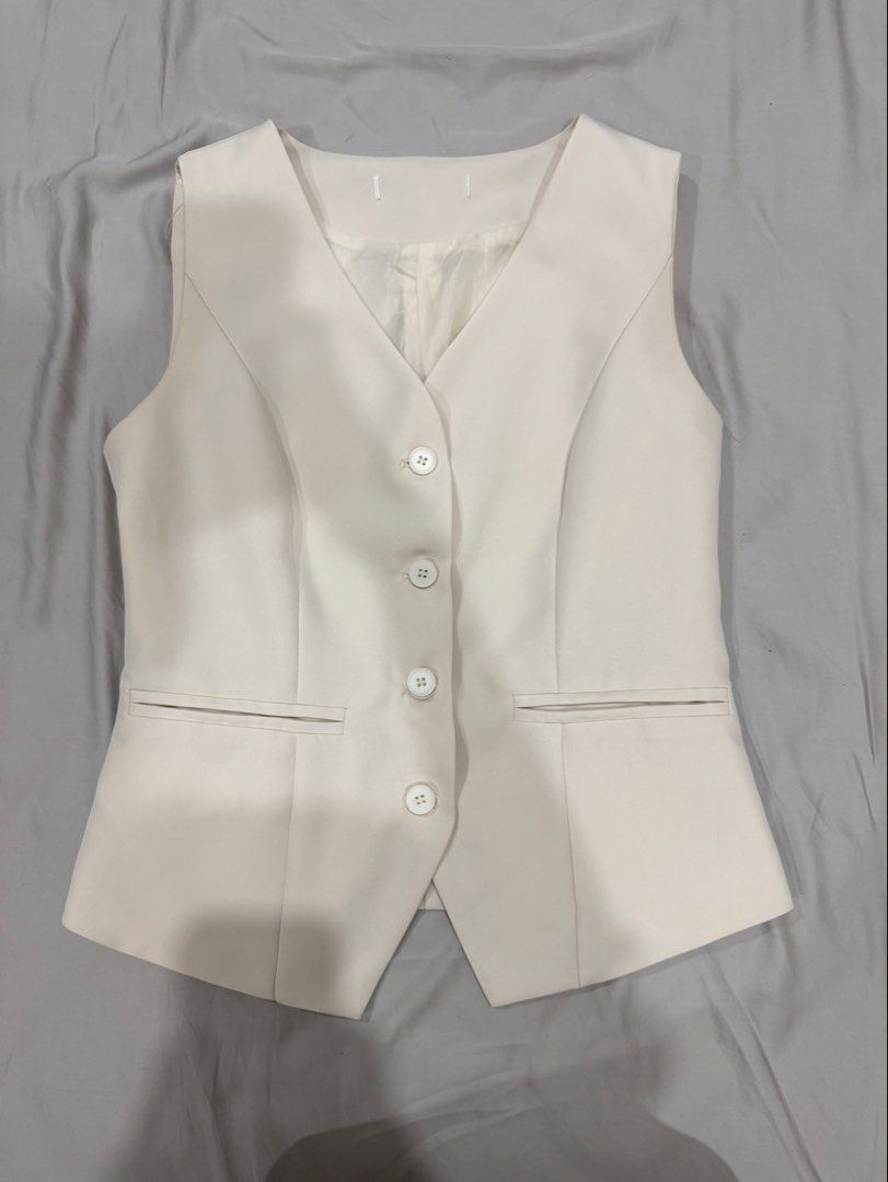 White cream classy button vest top (Category: Sleeveless) located in Davao. Submitted by mslbt (Listing ID 1467381623, Image 1). Description: Forgot the brand Super nice & high quality Fits small-medium No when worn photo Last price already.