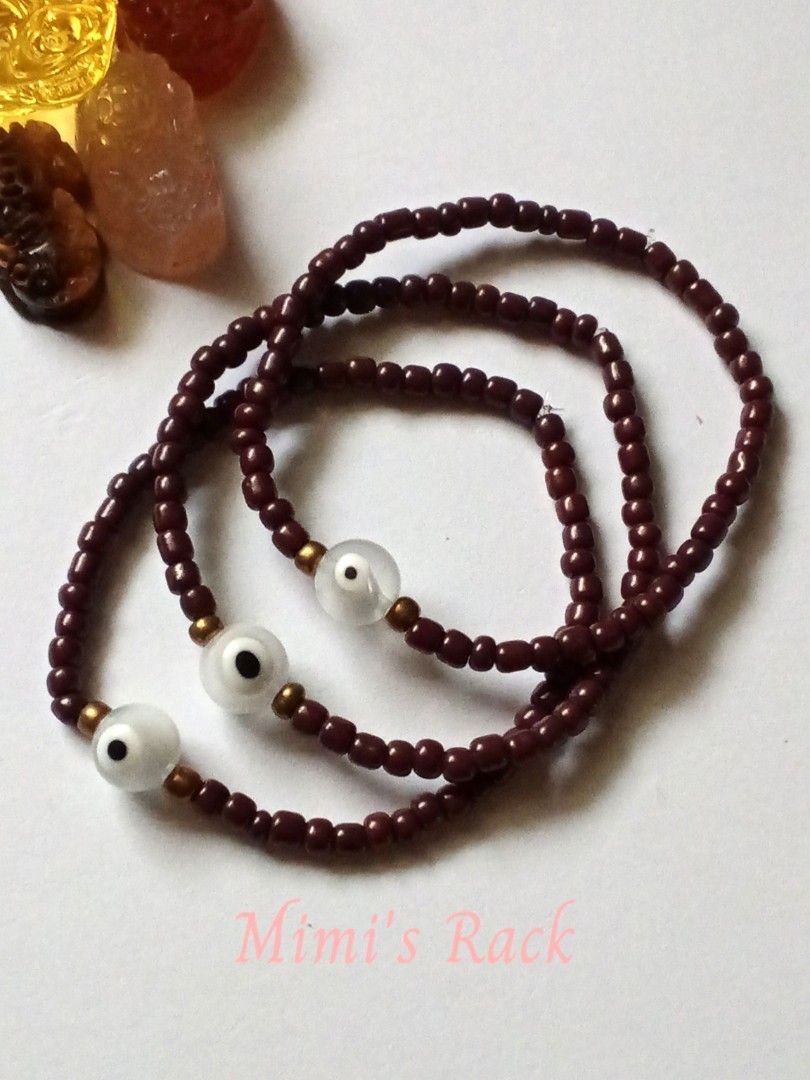 White Evil Eye in Brown Seed Beads Bracelet (Category: Bracelets) located in Taguig. Submitted by mimisrack (Listing ID 1467532785, Image 1). Description: 🤎A charming evil eye bracelet featuring rich brown seed beads, translucent white evil eye charms, and golden accent beads. - Its earthy brown tones give it a simple yet unique look, perfect for everyday wear or stacking with your favorite bracelets. ✨ Symbolic Benefits: 🧿 Protection – Traditi