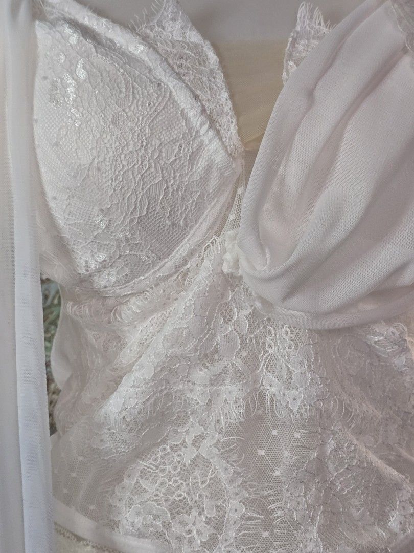White Lace Corset Top with Draped Chiffon Detailing (Category: Dresses) located in Dagupan City. Submitted by chislocker14 (Listing ID 1467524664, Image 2). Description: - Color: White - Style: Structured corset bodice with floral lace overlays and sheer mesh panels.