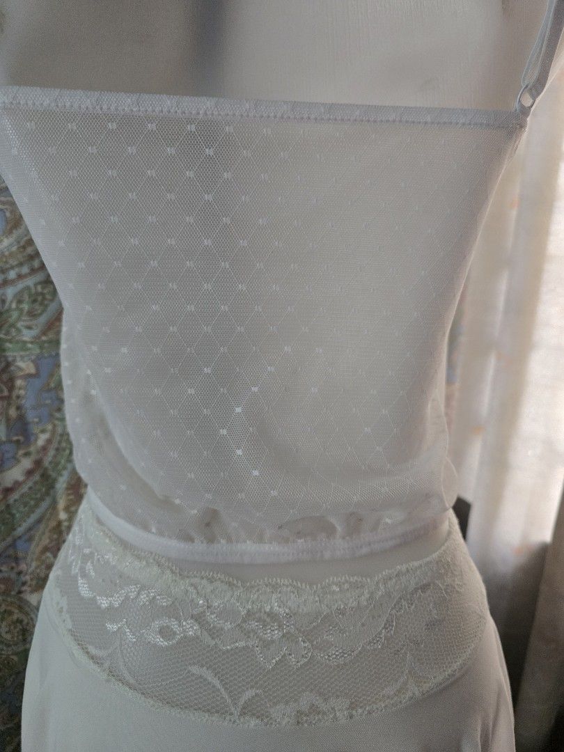 White Lace Corset Top with Draped Chiffon Detailing (Category: Dresses) located in Dagupan City. Submitted by chislocker14 (Listing ID 1467524664, Image 3). Description: - Color: White - Style: Structured corset bodice with floral lace overlays and sheer mesh panels.