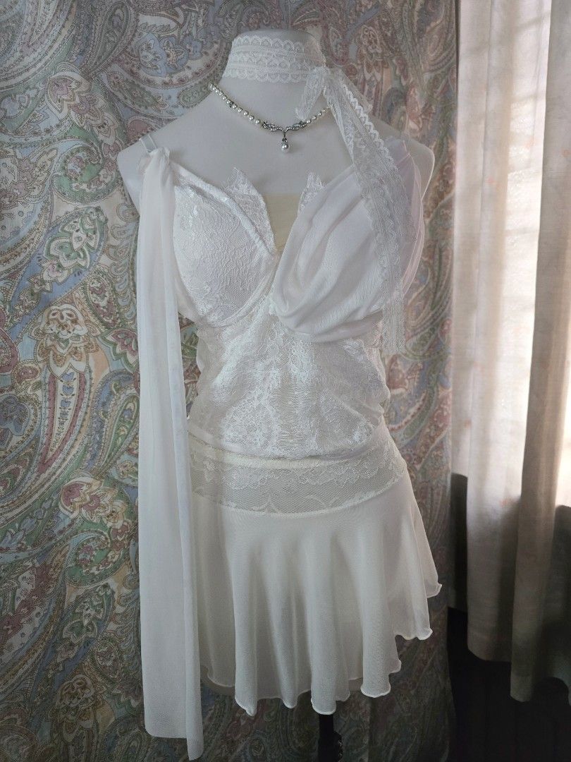 White Lace Corset Top with Draped Chiffon Detailing (Category: Dresses) located in Dagupan City. Submitted by chislocker14 (Listing ID 1467524664, Image 1). Description: - Color: White - Style: Structured corset bodice with floral lace overlays and sheer mesh panels.