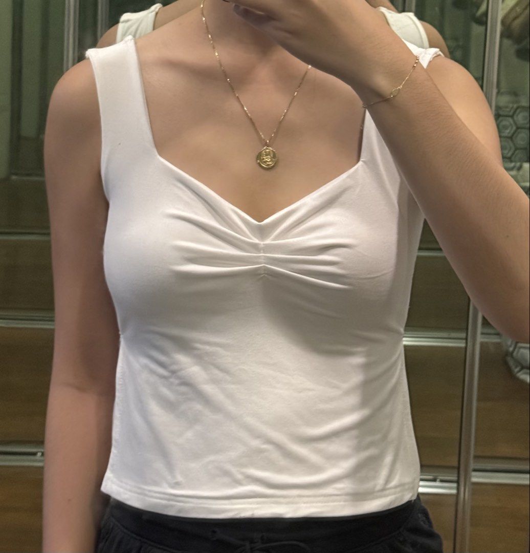 White Ruched Front Tank Top (Category: Sleeveless) located in Pasig City. Submitted by mxvxt (Listing ID 1467464711, Image 1). Description: 〰 in good condition, used once 〰 fits XS-S frame 〰 lightweight and breathable fabric 〰 has slits on both sides 〰 cute & dainty european summer top! 〰 rfs: decluttering .