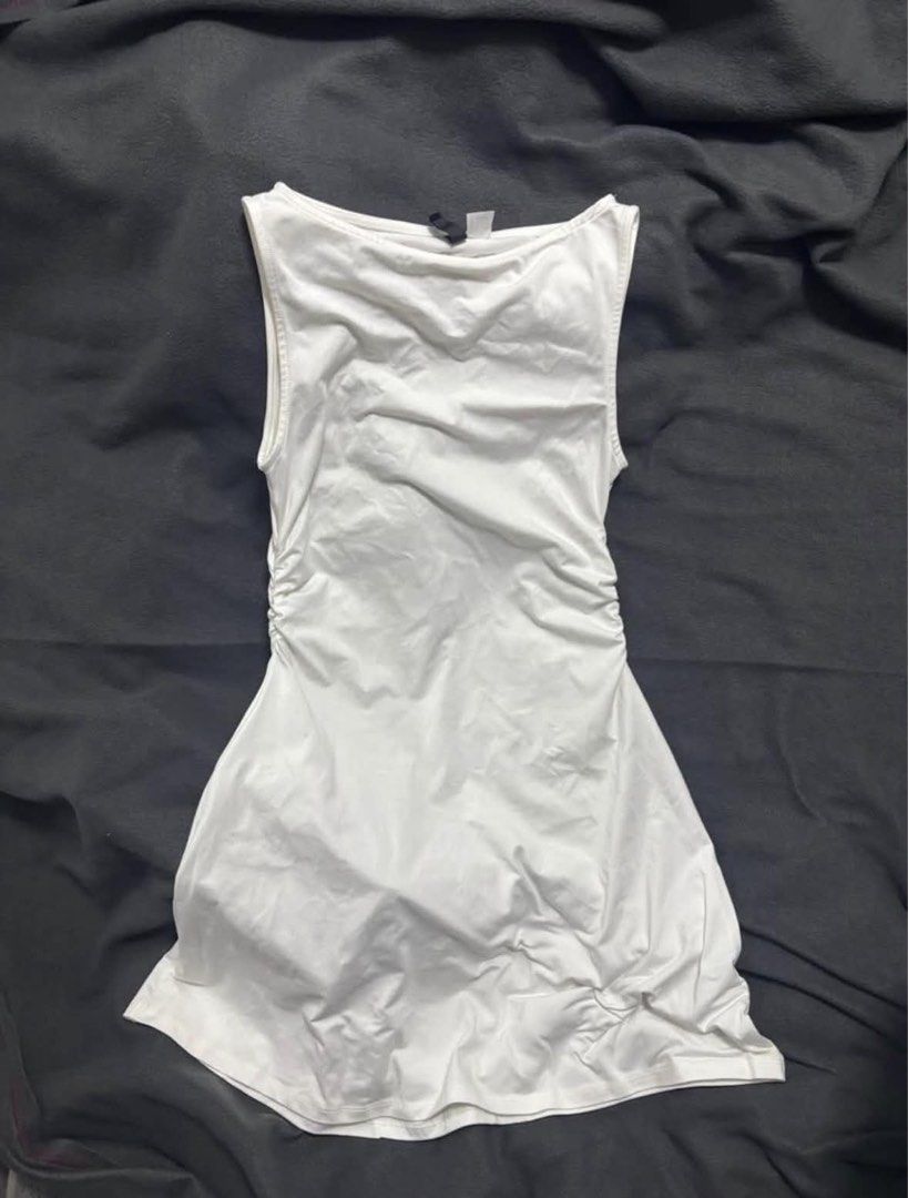 White Ruched Sleeveless Mini Dress (Category: Dresses) located in Manila. Submitted by lola.29 (Listing ID 1467484035, Image 1). Description: - Color: White - Style: Sleeveless mini dress with boat neckline - Fit: Flattering side ruching for a body-hugging look - Fabric: Soft and stretchy for all-day comfort - Versatility: Perfect for casual daytime outings or night outs .