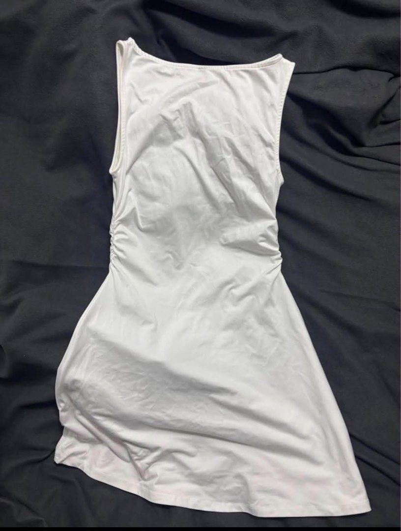 White Ruched Sleeveless Mini Dress (Category: Dresses) located in Manila. Submitted by lola.29 (Listing ID 1467484035, Image 2). Description: - Color: White - Style: Sleeveless mini dress with boat neckline - Fit: Flattering side ruching for a body-hugging look - Fabric: Soft and stretchy for all-day comfort - Versatility: Perfect for casual daytime outings or night outs .