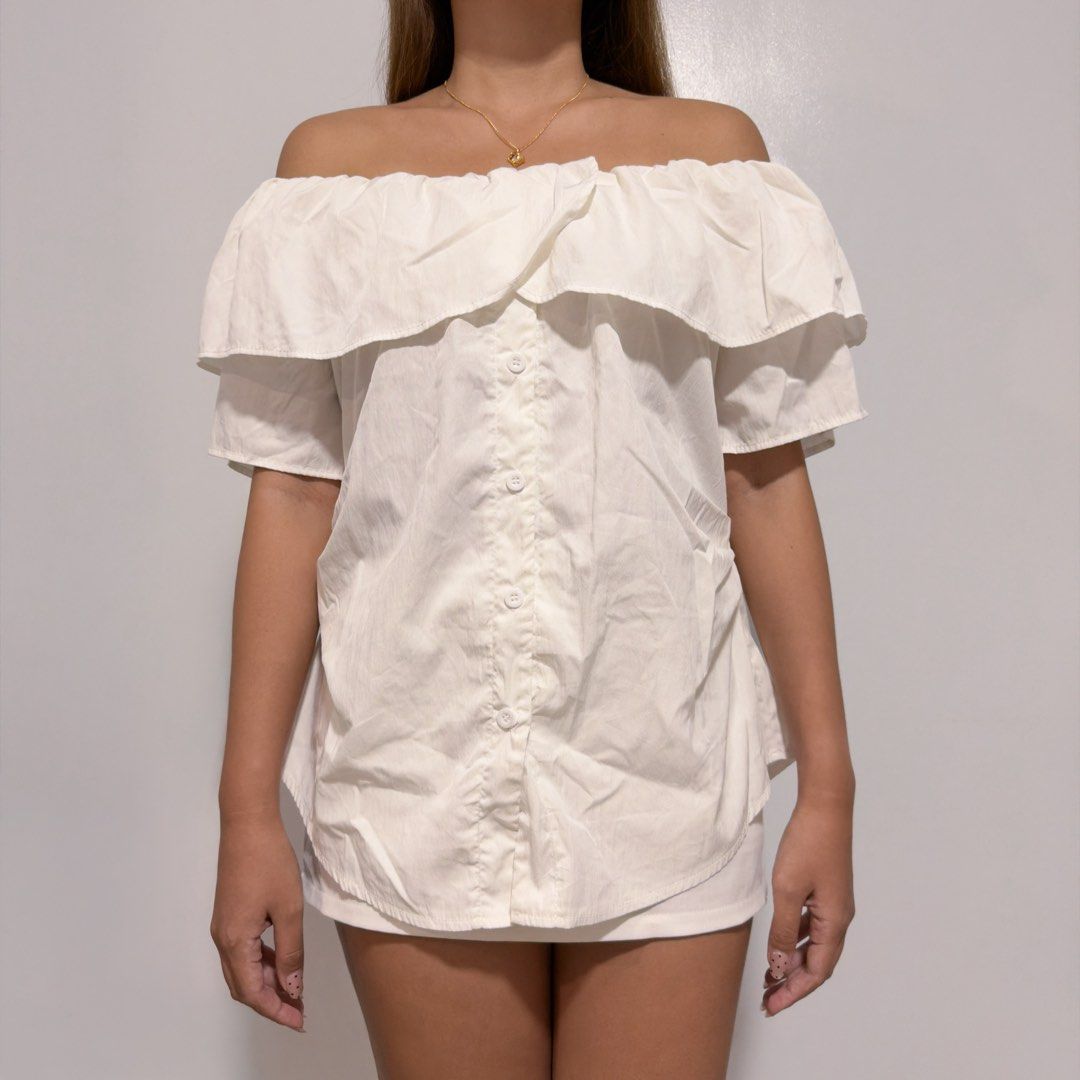 white ruffled off shoulder (Category: Others Tops) located in Cebu City. Submitted by cuteoncue (Listing ID 1467589552, Image 1). Description: med-large please see last photo for minor discoloration. there’s also a barely visible stain on the sleeve (not shown, but I can DM a photo). the item was laundered but not soaked or stain-treated..