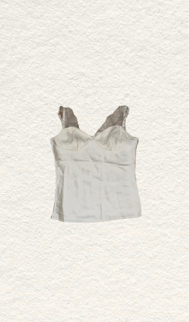 White Satin Tank Top with Lace Trim (Category: Sleeveless) located in Quezon City. Submitted by zealhorse_a9f3c3 (Listing ID 1465620155, Image 1). Description: - Color: Elegant white with a subtle sheen - Material: Soft, high-quality satin fabric - Design: V-neck cut with delicate lace detailing on cups and straps - Styling: Versatile piece, great for layering or wearing on its own - Condition: Excellent / Brand new.