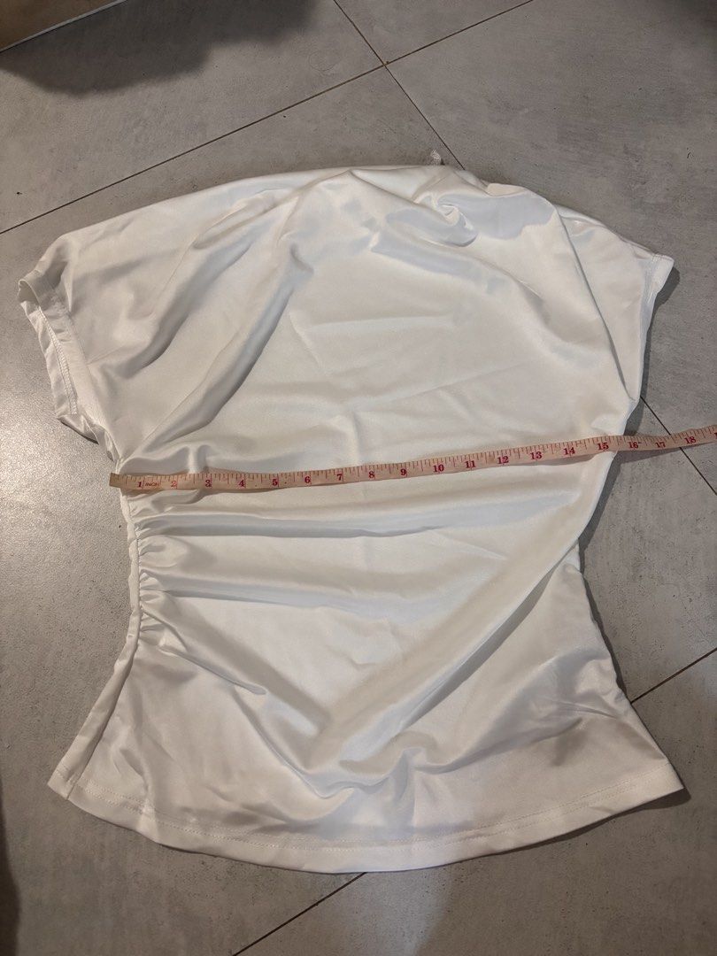 White silk top (Category: Shirts) located in Manila. Submitted by nicoleaaa (Listing ID 1467456623, Image 1). Description: - Color: Plain white - Size: M - Material: 89% polyester, 11% elastane (smooth with slight stretch) - Neckline: Standard crew neck - Details: Interior care and size tags attached - Origin: Made in China.