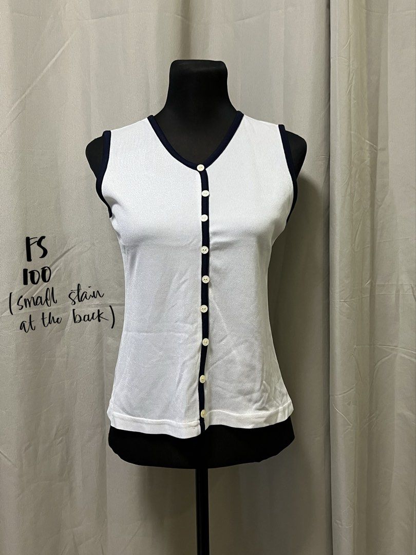 White sleeveless button front top (Category: Sleeveless) located in Las Pinas. Submitted by jilanah (Listing ID 1467563104, Image 1). Description: SMALL STAIN AT THE BACK AS SHOWN.