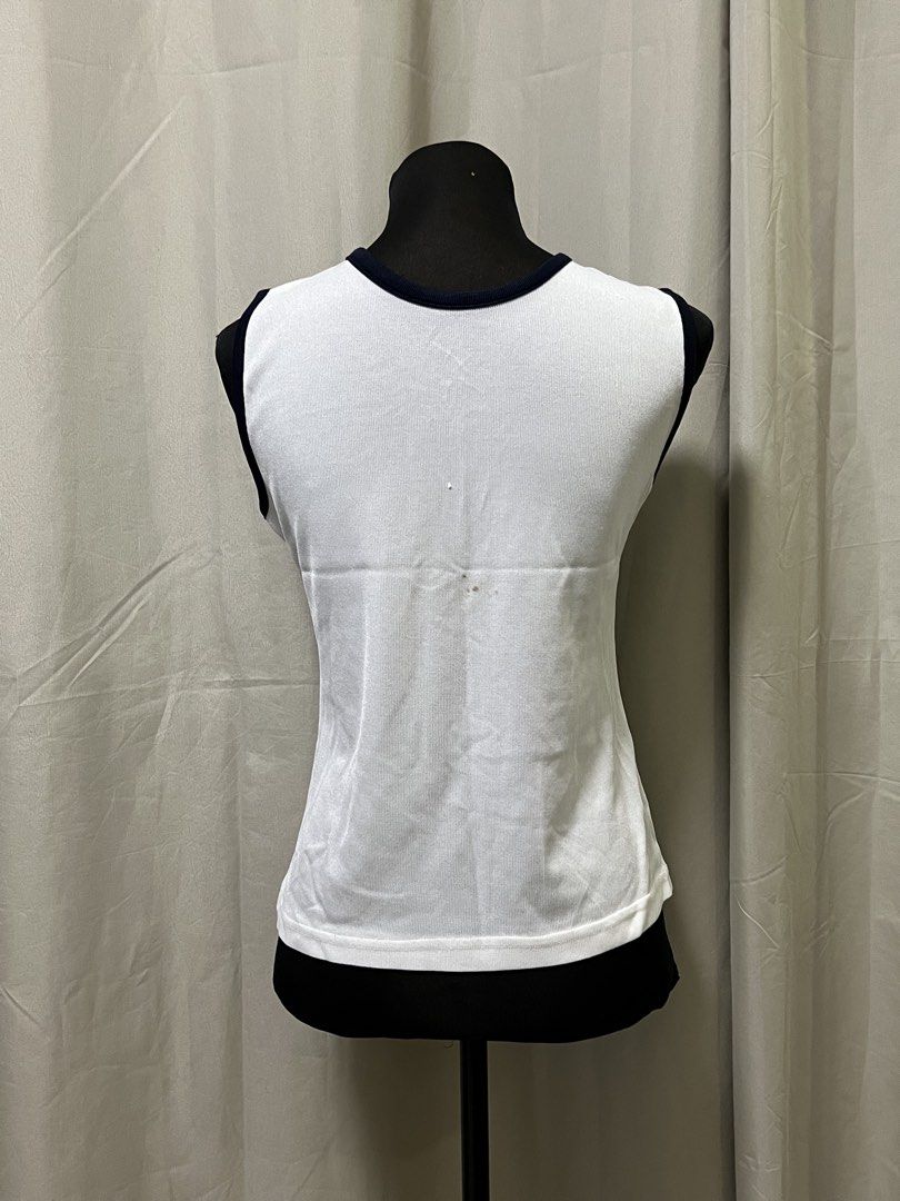 White sleeveless button front top (Category: Sleeveless) located in Las Pinas. Submitted by jilanah (Listing ID 1467563104, Image 2). Description: SMALL STAIN AT THE BACK AS SHOWN.