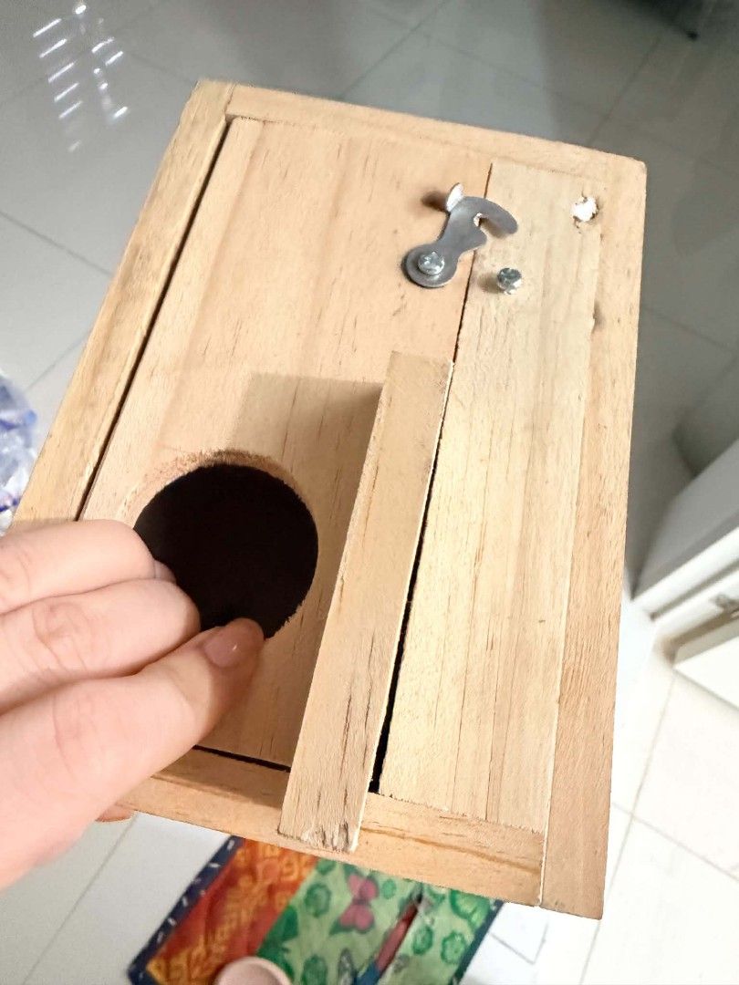 Wooden Birdhouse Breeding Box Nesting Box (Category: Storage Boxes & Baskets) located in Manila. Submitted by coolcrystal_59d22e (Listing ID 1467382286, Image 1). Description: - Natural wood breeding box suitable for small pets and garden wildlife - Circular front entry hole with a convenient small wooden platform below - Secure metal latch mechanism keeps the top tightly closed - Unfinished wooden surface, ready to use immediately or customize w