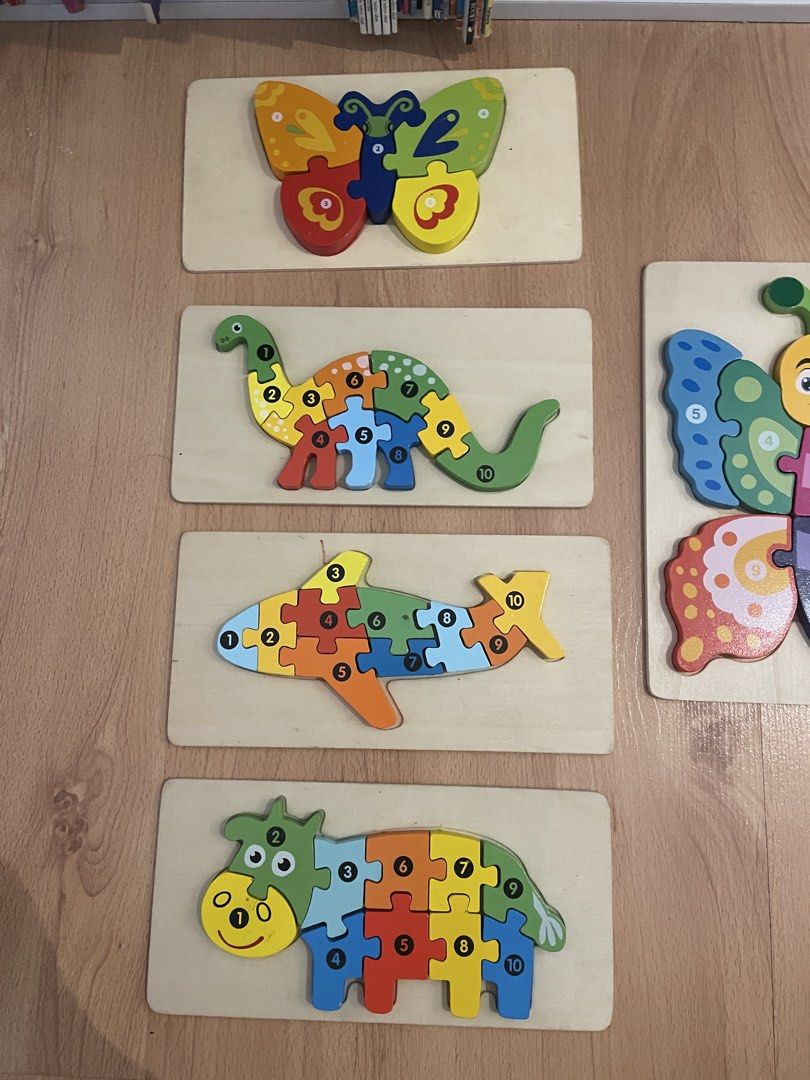 Wooden Puzzles (Category: Educational & Learning Toys) located in Cainta. Submitted by pnedp2022 (Listing ID 1467433989, Image 3). Description: - Bundle of 6 wooden number puzzles - Features printed numbers on each piece for easy counting practice - Helps develop hand-eye coordination and early math skills for toddlers - Comes with sturdy wooden base boards for durability - Condition is 9/10 used a few times - Loc: Greenwoods Pasig/Cainta - Take 