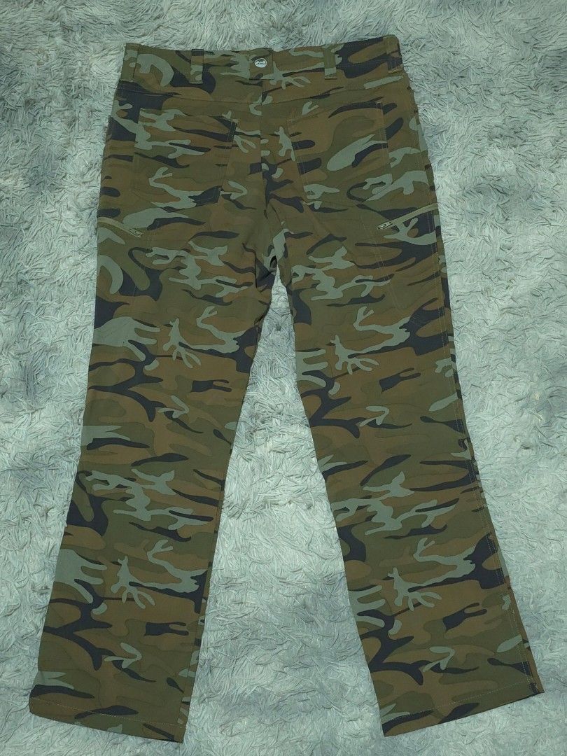 Wrangler Camouflage Cargo Pants (Category: Jeans) located in Abulug. Submitted by humanwhosellthings (Listing ID 1467365959, Image 2). Description: WRANGLER CAMOU Hiking Pants ✅Excellent Condition ✅Issue: none ▫️Waist Size: 34 ▫️Length: 40 - Color/Print: Green camouflage - Fit: Standard fit - Features: Multiple utility pockets, secure zippered leg pocket, belt loops, and front button closure - Material: Durable fabric built for outdoor activities