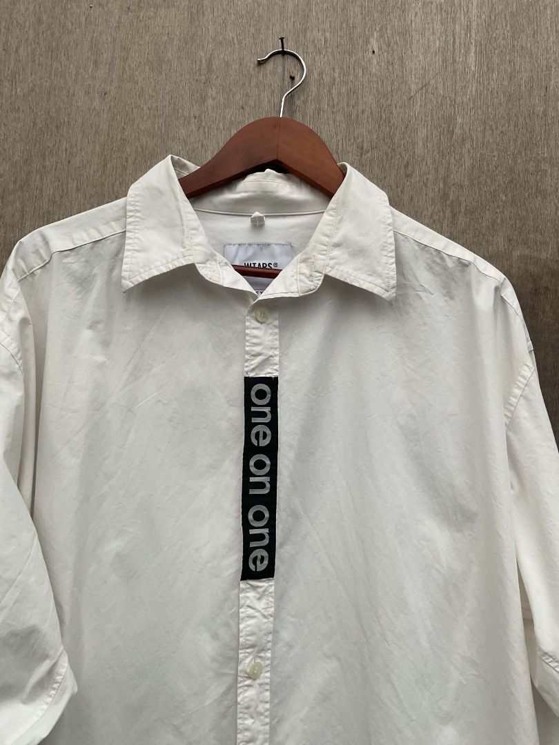 WTAPS x UNDERCOVER collaboration white button-down shirt (Category: Tshirts & Polo Shirts ) located in Talisay. Submitted by justindanielle17 (Listing ID 1467456894, Image 3). Description: -Authentic -25 inches width -30 inches length -Excellent Condition -9.8/10 color rate - Brand: WTAPS x UNDERCOVER - Color: Clean White - Size: XL / 04 (Marked on collar tag) - Material: 100% Cotton, Made in Japan - Details: WTAPS engraved branded buttons, black