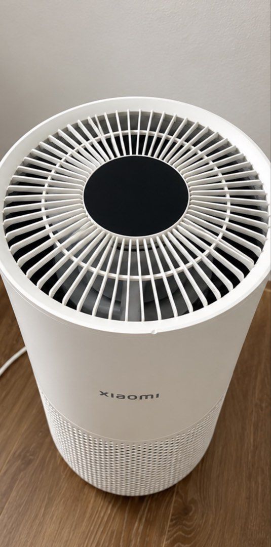 Xiaomi Smart Air Purifier (Category: Air Purifiers & Dehumidifiers) located in Manila. Submitted by shavielynt99771 (Listing ID 1467535125, Image 2). Description: - Brand: Xiaomi Air Purifier - Color: White - Design: Minimalist cylindrical shape with 360-degree bottom ventilation and top fan grill - Condition: Clean, 100% working condition - Features: Compact size, fits easily in room corners, plugs into standard wall outlets - Perfect for: Bedro