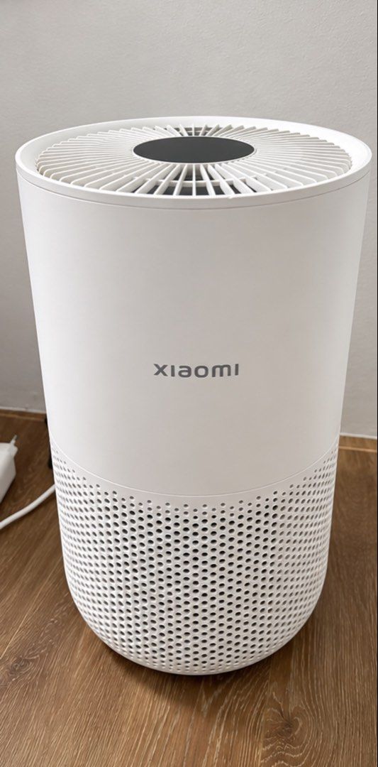 Xiaomi Smart Air Purifier (Category: Air Purifiers & Dehumidifiers) located in Manila. Submitted by shavielynt99771 (Listing ID 1467535125, Image 1). Description: - Brand: Xiaomi Air Purifier - Color: White - Design: Minimalist cylindrical shape with 360-degree bottom ventilation and top fan grill - Condition: Clean, 100% working condition - Features: Compact size, fits easily in room corners, plugs into standard wall outlets - Perfect for: Bedro