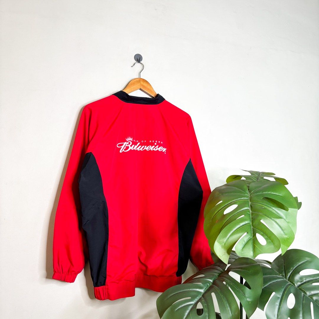 Y2K Budweiser | Windbreaker. (Category: Coats, Jackets and Outerwear) located in Manila. Submitted by bypiecesandstories (Listing ID 1467403455, Image 2). Description: Y2K Budweiser | Windbreaker. 649 PHP 🧡 Perfect Condition Can Fit — Medium to X Large Dimensions — W 24" L 29" A red and black Budweiser windbreaker with a bold color blocked design. A nice outerwear piece that brings a sporty, throwback feel to any casual fit. • REMINDERS • — Read