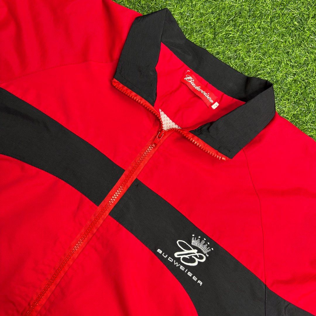 Y2K Budweiser | Windbreaker. (Category: Coats, Jackets and Outerwear) located in Manila. Submitted by bypiecesandstories (Listing ID 1467403455, Image 3). Description: Y2K Budweiser | Windbreaker. 649 PHP 🧡 Perfect Condition Can Fit — Medium to X Large Dimensions — W 24" L 29" A red and black Budweiser windbreaker with a bold color blocked design. A nice outerwear piece that brings a sporty, throwback feel to any casual fit. • REMINDERS • — Read
