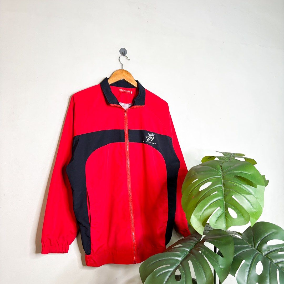 Y2K Budweiser | Windbreaker. (Category: Coats, Jackets and Outerwear) located in Manila. Submitted by bypiecesandstories (Listing ID 1467403455, Image 1). Description: Y2K Budweiser | Windbreaker. 649 PHP 🧡 Perfect Condition Can Fit — Medium to X Large Dimensions — W 24" L 29" A red and black Budweiser windbreaker with a bold color blocked design. A nice outerwear piece that brings a sporty, throwback feel to any casual fit. • REMINDERS • — Read