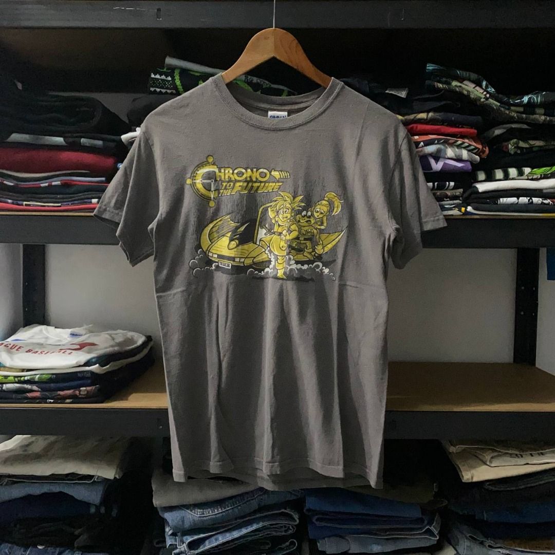 Y2K Chrono Trigger Game Promo Tee (Category: Tshirts & Polo Shirts ) located in Legazpi City. Submitted by southeastjunkies (Listing ID 1467563124, Image 1). Description: Chrono Trigger (Early 2000s Game Promo Shirt) (Chrono to the Future; Back to the Future Parody Style) 18x26.5 (Small) Chrono Trigger is a role-playing video game developed and published by Square for the Super Nintendo Entertainment System. .