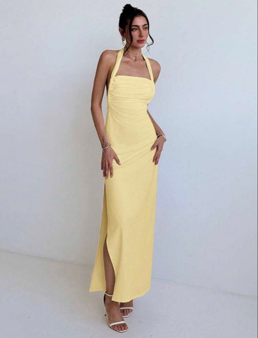 Yellow Halter Neck Backless Maxi Dress with Slit (Category: Dresses) located in Quezon City. Submitted by buyfromMebbie (Listing ID 1467557532, Image 2). Description: Color: Butter yellow ✨ Originally bought for ₱649 ✨ Worn once only! ✨ Size: Large, but can also fit Medium to Semi-Large ✨ Beautiful open-back design with a flattering silhouette and side slit Please note: The halter strap is a bit too long and may need a slight alteration for a bet