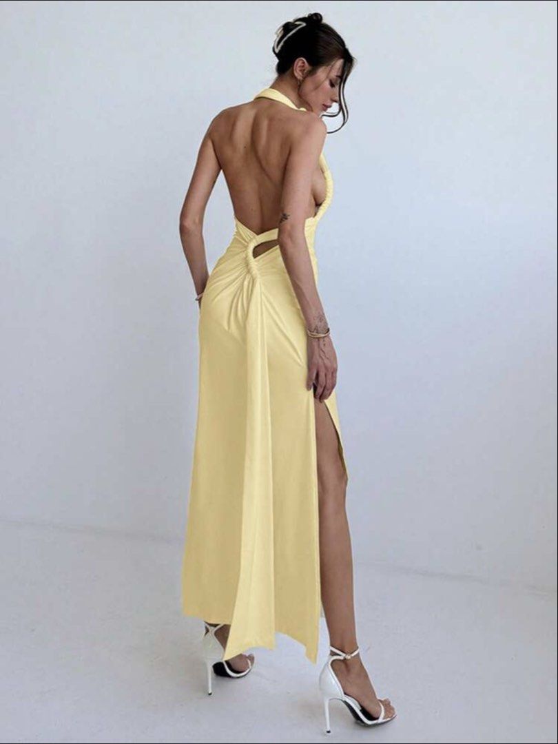 Yellow Halter Neck Backless Maxi Dress with Slit (Category: Dresses) located in Quezon City. Submitted by buyfromMebbie (Listing ID 1467557532, Image 1). Description: Color: Butter yellow ✨ Originally bought for ₱649 ✨ Worn once only! ✨ Size: Large, but can also fit Medium to Semi-Large ✨ Beautiful open-back design with a flattering silhouette and side slit Please note: The halter strap is a bit too long and may need a slight alteration for a bet