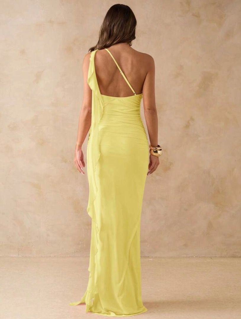 Yellow One-Shoulder Ruffle Maxi Dress (Category: Dresses) located in Bacolod City. Submitted by veeebee.4 (Listing ID 1467456965, Image 2). Description: - Color: Bright yellow - Style: One-shoulder maxi dress with a floor-length hem - Design: Long cascading ruffle detail running down the front and back - Fit: Fitted ruched body that flatters your figure - Material: Smooth, stretchy fabric for comfortable wear .