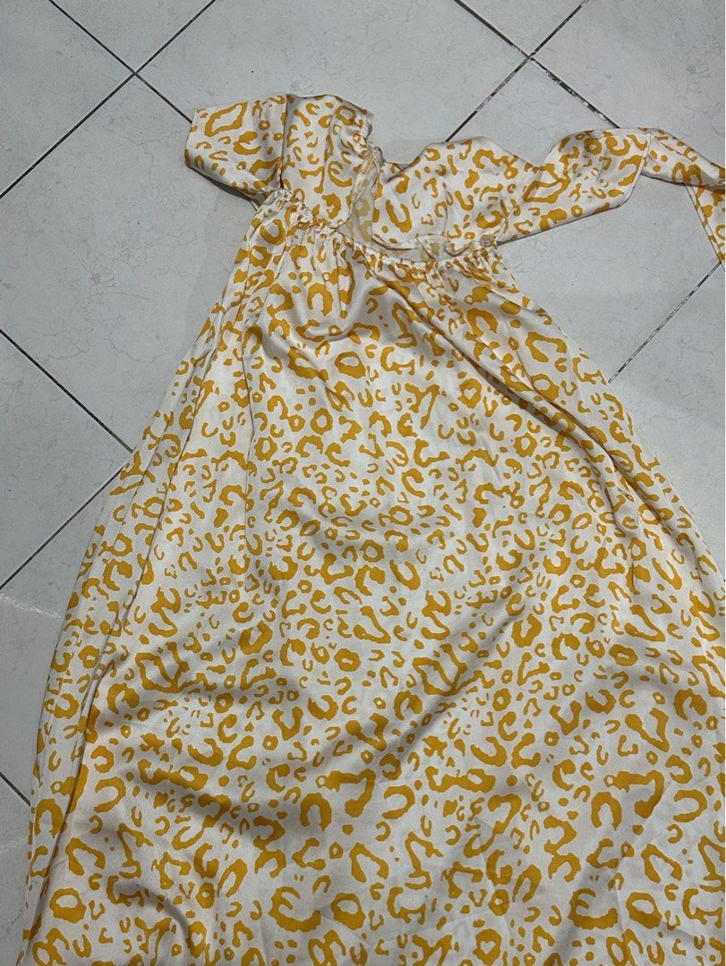 Yellow patterned halter neck long dress (Category: Dresses) located in Manila. Submitted by isabella_201013 (Listing ID 1467477332, Image 3). Description: - Color/Pattern: Yellow and white patterned - Style: Halter neck with thin straps, flowy fit - Length: Midi to maxi (depending on height) - Material: Light and breezy fabric - Condition: Used once or twice - Size: Standard sizing, fits most mediums.