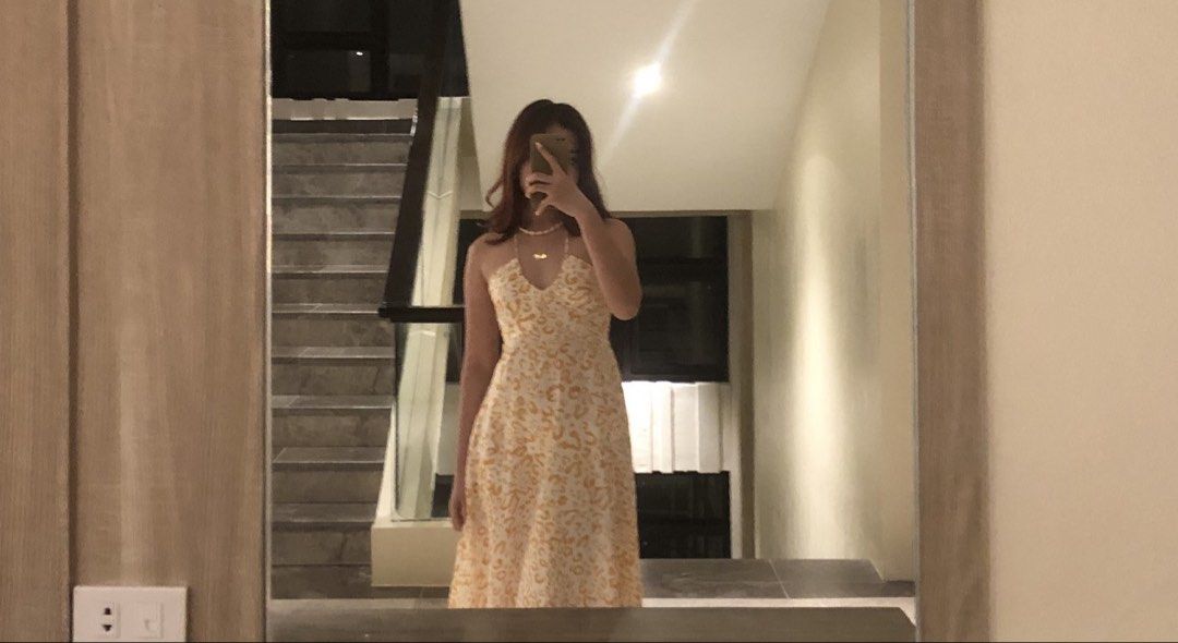 Yellow patterned halter neck long dress (Category: Dresses) located in Manila. Submitted by isabella_201013 (Listing ID 1467477332, Image 1). Description: - Color/Pattern: Yellow and white patterned - Style: Halter neck with thin straps, flowy fit - Length: Midi to maxi (depending on height) - Material: Light and breezy fabric - Condition: Used once or twice - Size: Standard sizing, fits most mediums.