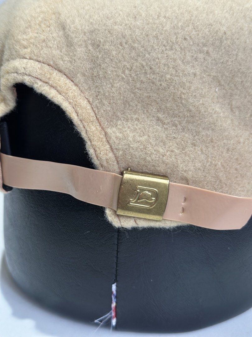 Yoder & Frey Inc. Auctioneers Wool Cap (Category: Caps & Hats) located in Daet. Submitted by thrifthings2018 (Listing ID 1467446471, Image 2). Description: - Color: Tan wool with a green underbrim - Design: Structured crown, flat brim, and braided cord trim - Patch: Embroidered Yoder & Frey, Inc. Auctioneers logo on the front - Comfort: Dri-N-Cool interior sweatband - Fit: Adjustable strap closure with gold-tone hardware - Condition: Clean and re