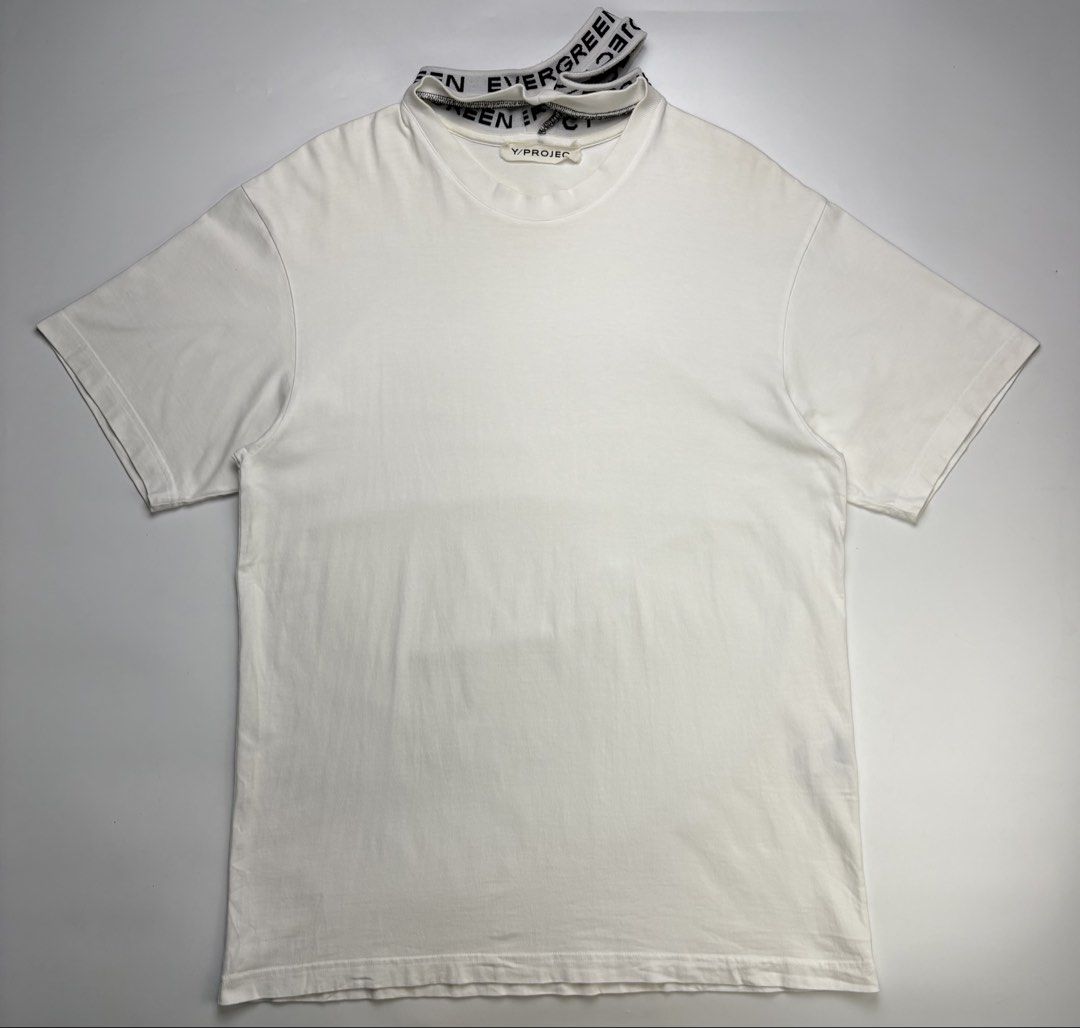 Y/Project Evergreen Three Collar Tee (Category: Tshirts & Polo Shirts ) located in Cavite. Submitted by sc_rcity (Listing ID 1467482551, Image 2). Description: Tagged Size : Large Unisex Oversized Authentic Like New Color rate : 9.7/10 Minimal sign of wear Made in Bulgaria Color may vary due to lighting Relaxed fit white T-shirt constructed from a heavy weight organic cotton. Features an elasticized Y-shaped collar with jacquard text detailing. P