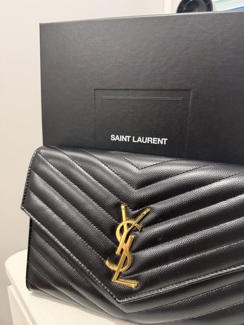 Ysl Clutch (Category: Clutches) located in Caloocan City. Submitted by minnieellezirkenna (Listing ID 1467583151, Image 2). Description: Selling my owned YSL grained leather clutch Complete with dustbag, carecards, and all the handles Bought from a trusted Milan shopper Guaranteed authentic and original Rfs: decluttering.