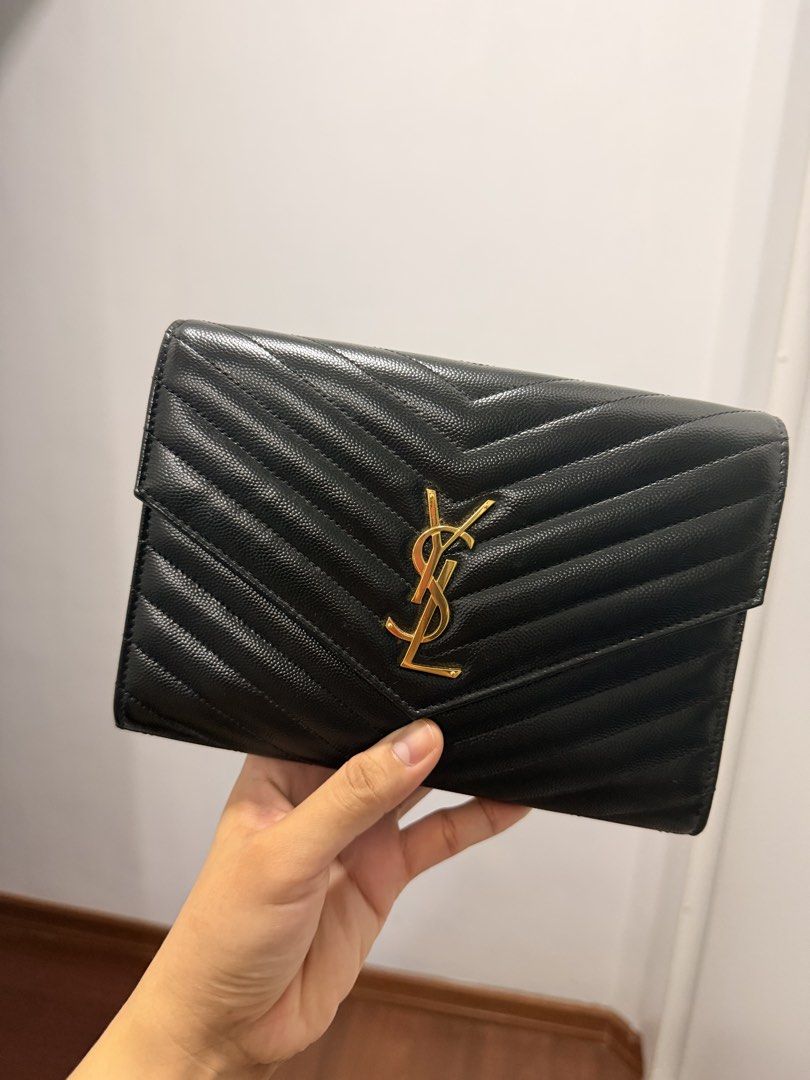 Ysl Clutch (Category: Clutches) located in Caloocan City. Submitted by minnieellezirkenna (Listing ID 1467583151, Image 1). Description: Selling my owned YSL grained leather clutch Complete with dustbag, carecards, and all the handles Bought from a trusted Milan shopper Guaranteed authentic and original Rfs: decluttering.